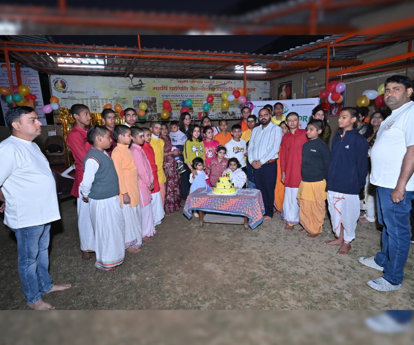 NCF volunteers and children gathered at an ashram celebration event — community outreach and social welfare programme